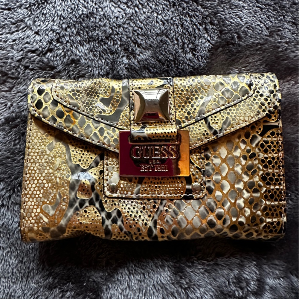 Guess wallet, gold. Mildly used.